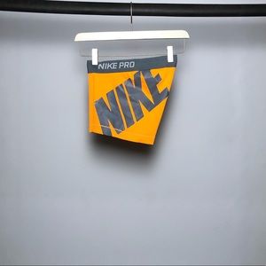 Orange Nike Pros with